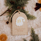 Dodos avant Noël : décompte en bois avec le nombre 22 sur le Père Noël blanc, entouré de sapin et d’oranges séchées.