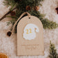 Dodos avant Noël : gros plan du Père Noël blanc portant le nombre 22 et de l’inscription gravée sur le bois.