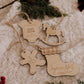 Ornement personnalisé - Formes : bas de Noël et cheval à bascule parmi un cache-couche et un bonhomme en bois.